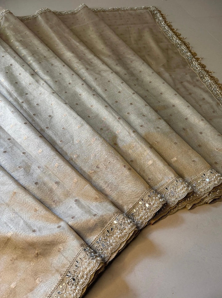 LUXURIOUS IVORY SHADE DESIGNER SOFT TISSUE SILK BOOTI SAREE WITH  LACE ATTACHED