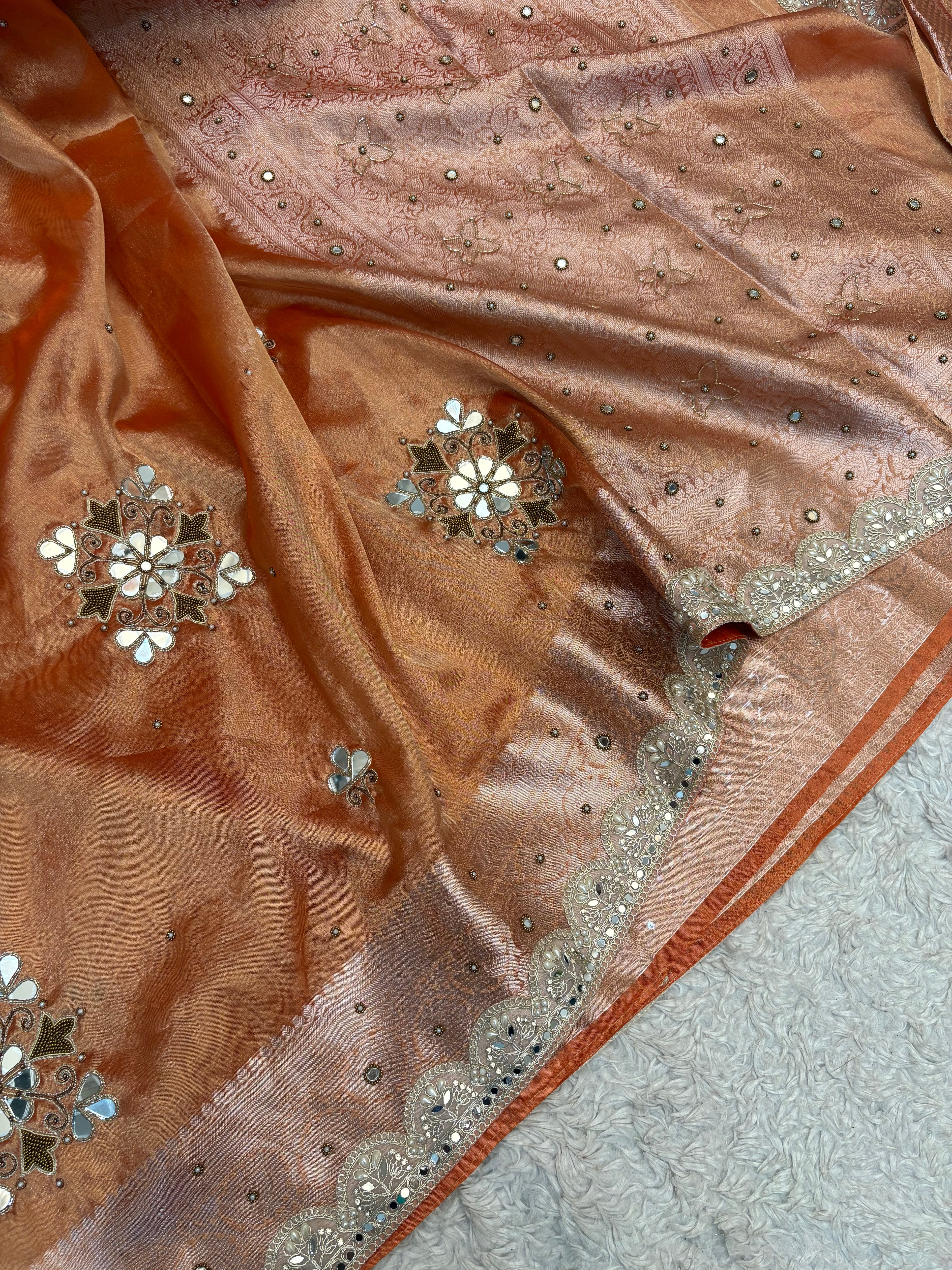 LUXURIOUS ORANGE SHADE SOFT TISSUE SILK SAREE WITH PREMIUM ZARDOZI MIRROR WORK AND LACE ATTACHED