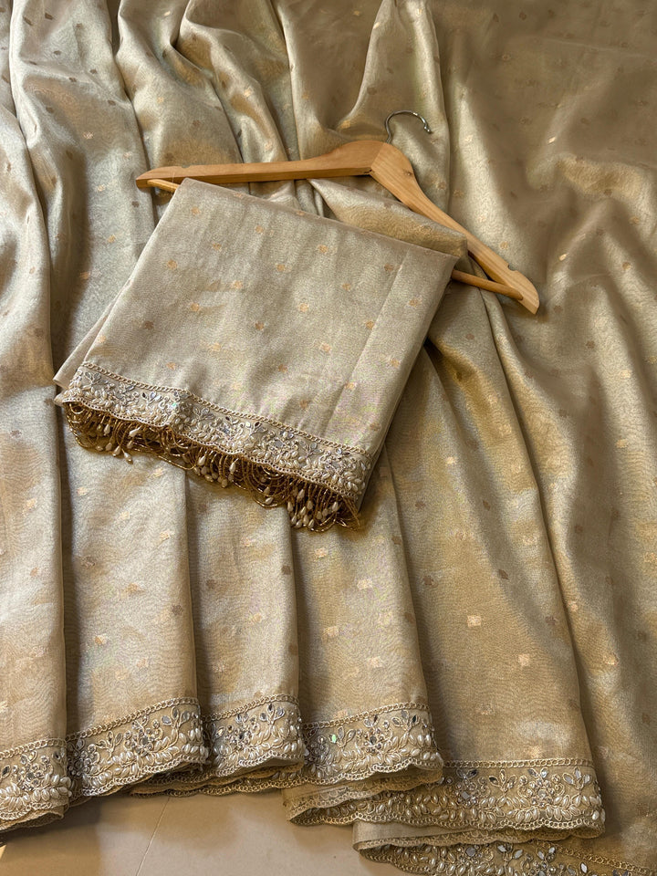 LUXURIOUS IVORY SHADE DESIGNER SOFT TISSUE SILK BOOTI SAREE WITH  LACE ATTACHED